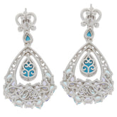 Elegant Pear Blue Turquoise Sterling Silver Earrings with intricate design and Topaz accents.